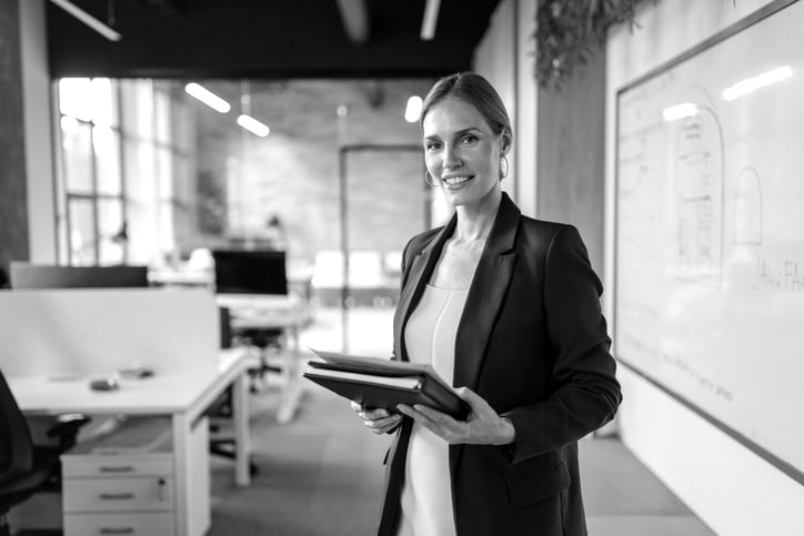 Businesswoman with tablet in modern office