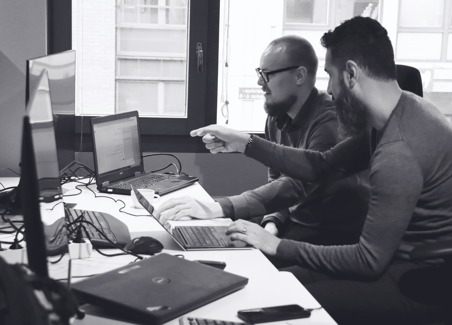 Men working on computers