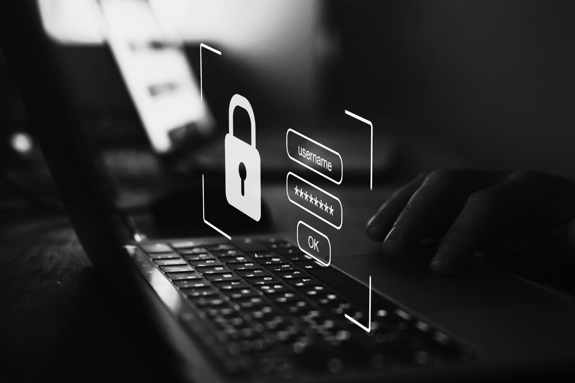 Login screen with password field over a laptop keyboard symbolizes IT security in the software testing process.